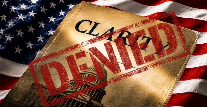 A symbolic image showing a document stamped with a red "DENIED" mark over the word "CLEARED," placed on top of an American flag with the US Capitol building visible.