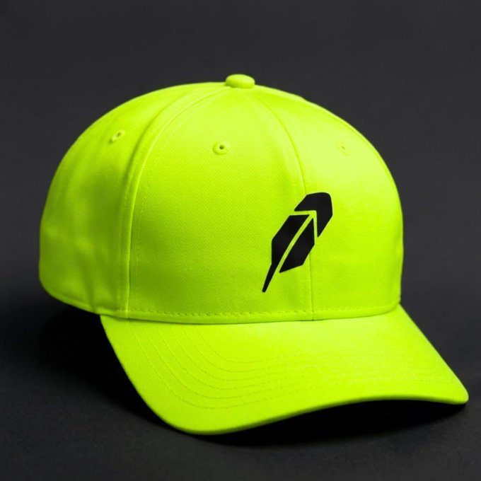A neon yellow baseball cap with a black stylized arrow logo on the front panel, displayed against a dark background.