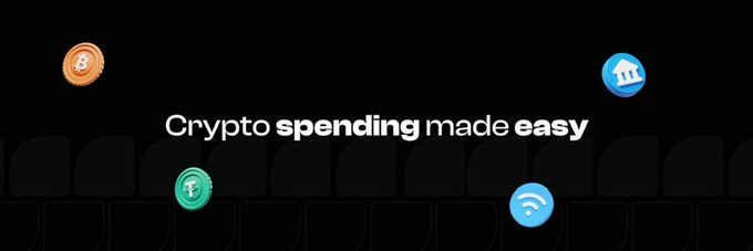 A dark promotional banner with the text 'Crypto spending made easy' alongside icons representing Bitcoin, a bank, Wi-Fi, and another cryptocurrency token.