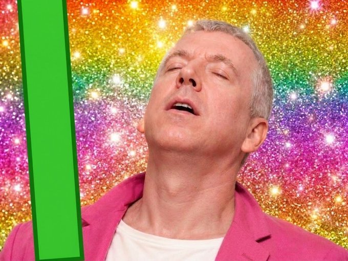 A man in a pink blazer stands against a sparkly rainbow background with his head tilted back and eyes closed in a blissful expression, paired with a post celebrating "Happy ath btw" (Happy anniversary, by the way).