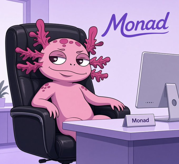 A cartoon of a pink axolotl sitting in a black office chair at a desk with a computer monitor and a nameplate reading 'Monad', with the word 'Monad' written in cursive in the top right corner.