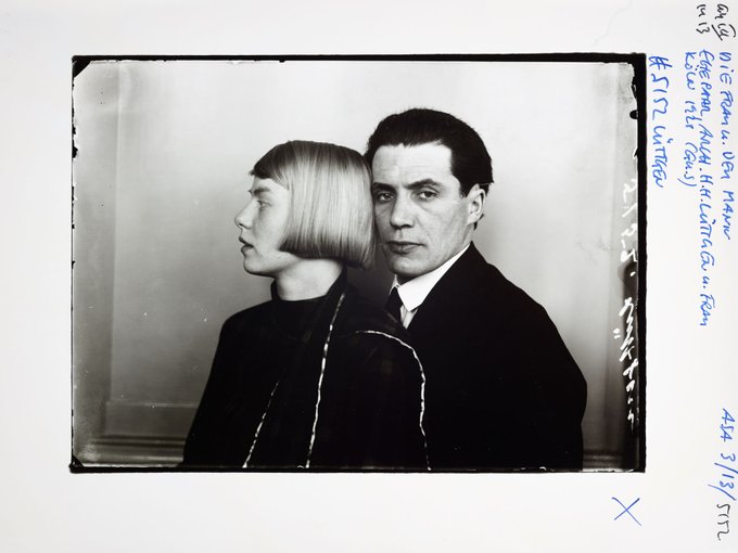 A vintage black and white portrait photograph, possibly from the early 20th century based on the handwritten archival annotations on the right margin, showing a woman with a bob haircut in profile and a man facing forward.