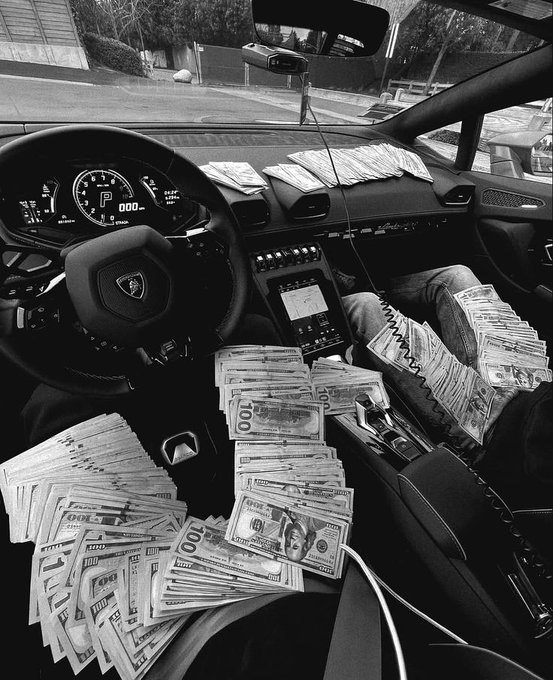 The image displays the interior of a Lamborghini filled with stacks of hundred-dollar bills, with the dashboard showing "P 000" and the steering wheel featuring the Lamborghini logo. The scene visually reinforces the post's aspirational message of financial abundance and lasting wealth, depicting an extravagant lifestyle of luxury and excess.