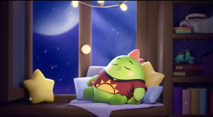 The image features a cartoon green monster sitting on a bed with pillows, looking relaxed as if taking a nap or sleeping. The scene takes place at night, with a window nearby that allows for natural light to enter the room. The background of the image is dark and blue, creating a calm atmosphere. The post about productivity and sleep habits seems to be related to this cartoon character's situation, suggesting that the monster might represent the importance of taking breaks or resting during busy workdays.