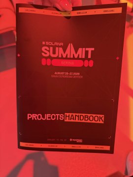 A red lanyard badge for the 'Solana Summit' conference in Serbia (August 23-27, 2025) displays 'Projects Handbook'.