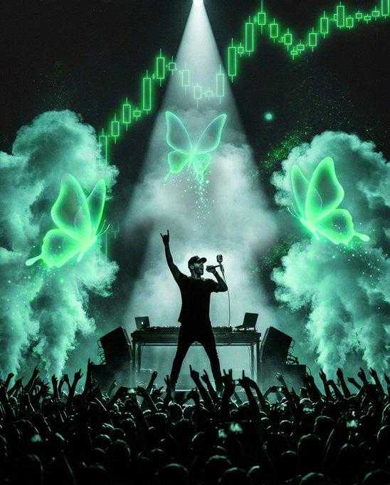 A performer stands on stage with arm raised, holding a microphone, surrounded by glowing green butterflies, billowing smoke, and a dramatic spotlight, while an excited crowd reaches up below. Floating green candlestick chart patterns overhead evoke financial markets, suggesting that "the feeling" being chased—whether in music or markets—often obscures the underlying numbers driving the moment.