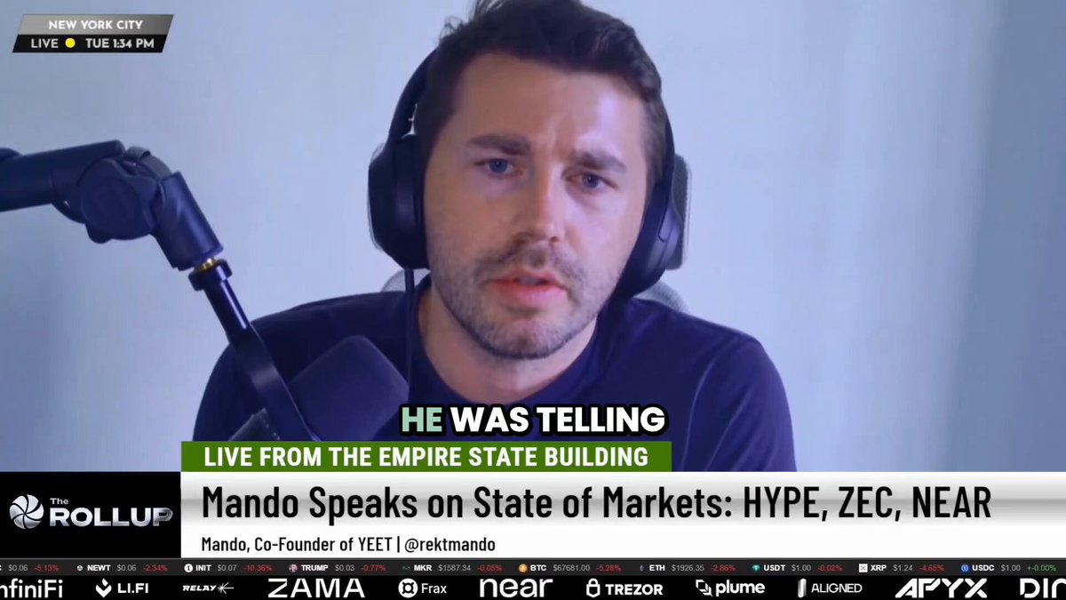The image shows a man wearing headphones sitting behind a microphone while talking at a radio show or podcast. The man appears to be discussing the evolution of Near stock trading software, which has caught his interest. The background features a white wall with various logos and text, including "Near", "Mendo", "@ilblackdragon", "@CryptoMichNL", and "focus on what is in the image".