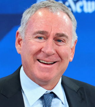 A smiling older man in a dark suit and patterned tie appears in front of a blue backdrop with partial "New" text visible, likely at a news studio, though his identity is not confirmed. His friendly, composed demeanor visually complements the optimistic tone of the Citadel bull market commentary accompanying the image.