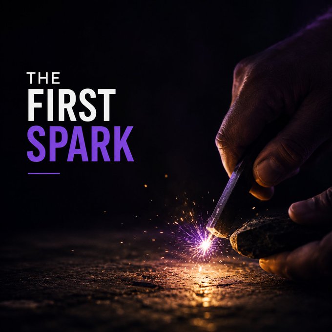 A dramatic promotional graphic titled 'THE FIRST SPARK' showing hands striking a metal rod against a rock, creating a bright glowing spark in the darkness.