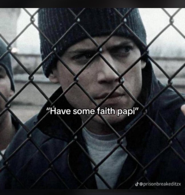 A meme featuring a close-up of the character Wentworth Miller as Michael Scofield from Prison Break behind a chain-link fence, with the overlaid text "Have some faith papi" and the watermark "@prisonbreakeditzx".