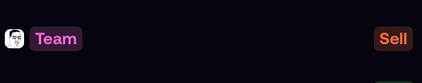 A simple dark background displaying three buttons or labels: a grey icon on the left, a purple 'Team' button, and a dark orange 'Sell' button on the right.