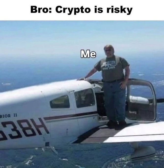 A meme showing a man standing on the wing of a small plane in mid-air, captioned "Bro: Crypto is risky" at the top and "Me" over the man.