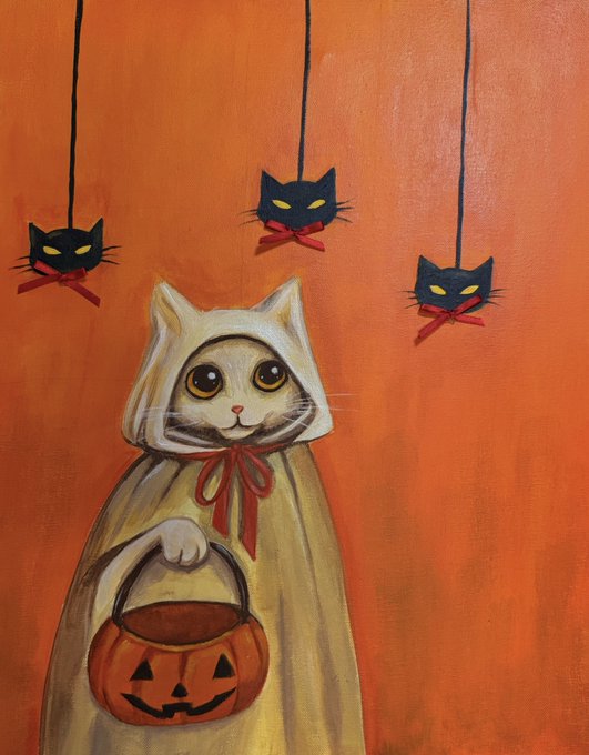 A painting of a white cat dressed in a cream-colored hooded cloak with a red ribbon, holding a jack-o'-lantern trick-or-treat bucket against an orange background with three black cat ornaments hanging from above.