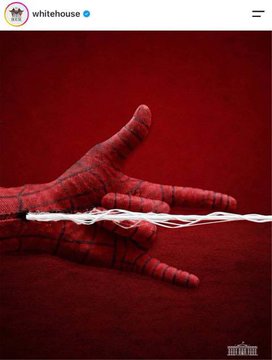 A red-tinted hand is shown with webbing between the fingers, resembling Spider-Man's hand, against a deep red background. The image, posted by the White House's verified account, plays on Uncle Ben's iconic quote about great power and great responsibility, humorously acknowledging the administration's "Spider-Man-like" abilities.