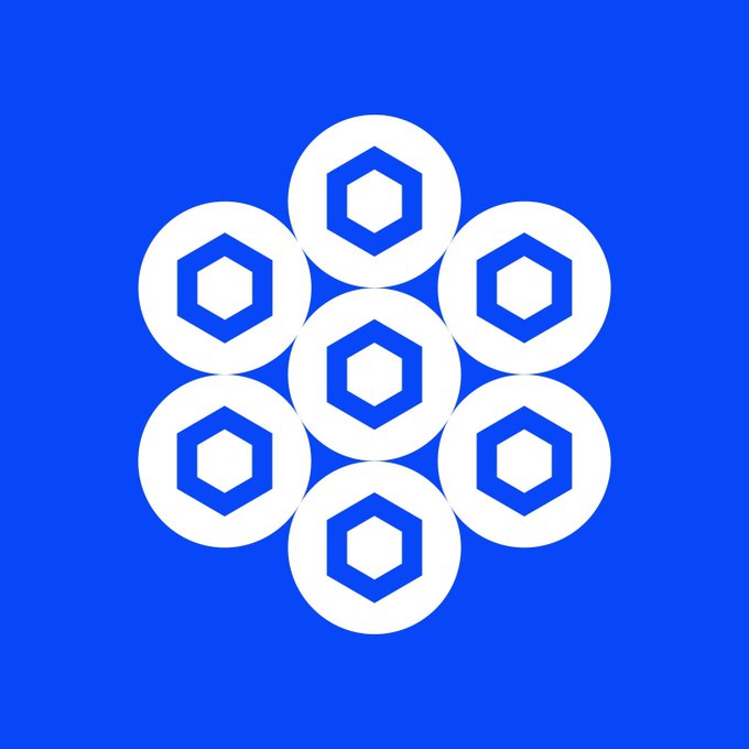 The image features a blue background with white hexagons arranged in a circular pattern, creating an eye-catching design. The text "BREAKING: Chainlink launched on mainnet 7 years ago today." is displayed below the image, indicating that the content was released seven years ago and is now available for viewing.