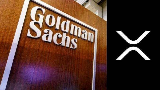 The Goldman Sachs logo on a wooden plaque alongside the XRP cryptocurrency logo on a black background.