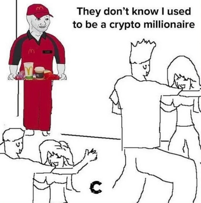 A McDonald's employee holding a food tray in his red uniform stands among customers, with text above reading "They don't know I used to be a crypto millionaire," humorously reflecting the post's theme of former crypto investors who lost their wealth and now work regular service jobs.