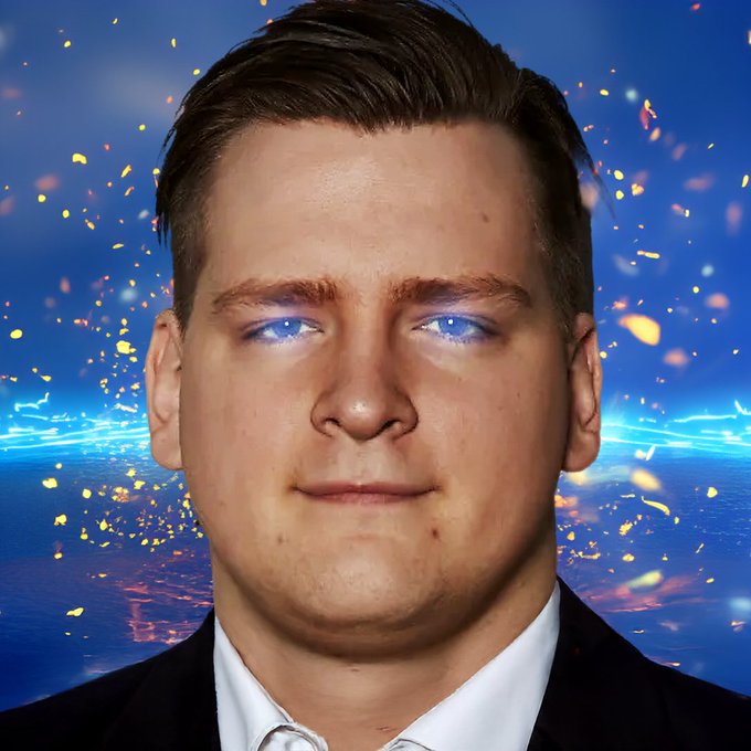 A digitally edited portrait of a young man with glowing blue eyes set against a stylized blue background with sparks and light effects.