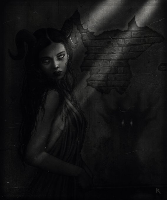 A dark, moody black and white artistic portrait of a woman with long hair and horns, standing near a brick wall illuminated by shafts of light.