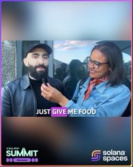 The image features a man with a beard wearing a black jacket, standing next to a woman who has glasses and a red scarf around her neck. They are both smiling at the camera. The background of the image shows a building, suggesting that they might be in an urban setting or attending an event. The caption below the image reads "you know what they say... never interview @mert when he' s hungry recap from Solana Summit Germany and some of the wonderful faces we got to meet".