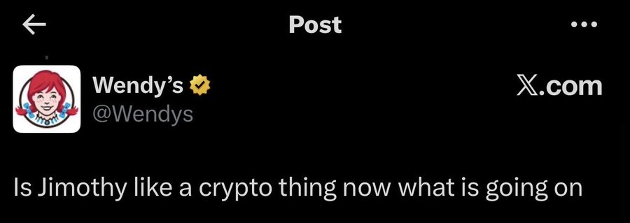 A screenshot of a tweet from the verified Wendy's Twitter account (@Wendys) that reads, "Is Jimothy like a crypto thing now what is going on," poking fun at the hype surrounding the $JIMOTHY cryptocurrency mentioned in the accompanying post.