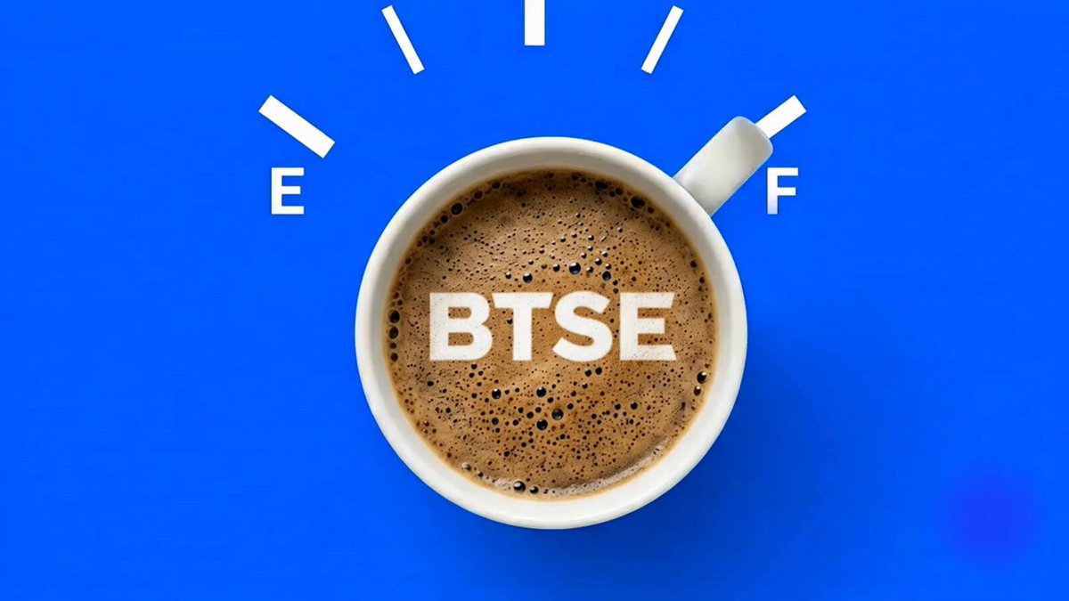 The image features a cup of coffee with the word "BTSE" written on top, which stands out against the blue background. The text also includes the phrase "WARNING: Low fuel detected after staring at those charts! Your personal trading energy boost has arrived #CoffeeTime #BTSE". This message is related to the image's theme of coffee and energy, suggesting that the viewer should pay attention to their energy levels or be aware of low fuel warnings.