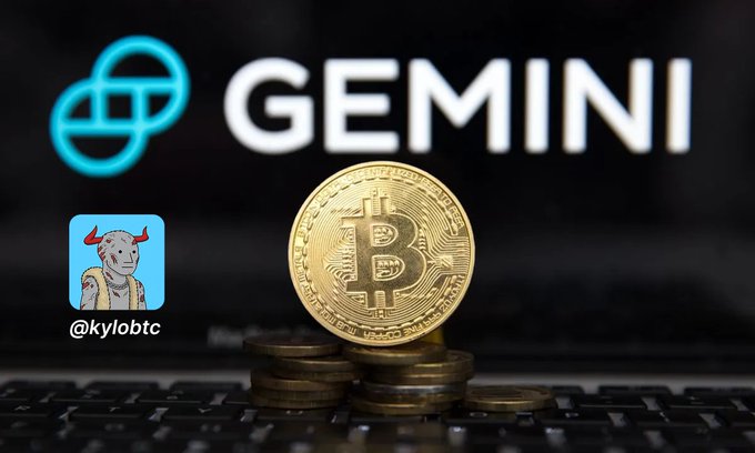 A gold Bitcoin token sits on a laptop keyboard with the Gemini logo in the background and a small @kylobtc profile picture featuring a bull-headed character.