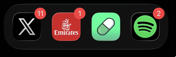 Four smartphone app icons are displayed on a black background, showing X (with 11 notifications), Emirates, a pill/capsule app, and Spotify (with 2 notifications), relating to the post "8 figs soon."