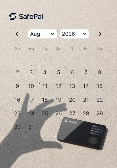 A SafePal branded calendar for August 2026 displayed on a sandy surface, with a hand shadow making a gesture and a SafePal hardware wallet device placed on the sand.