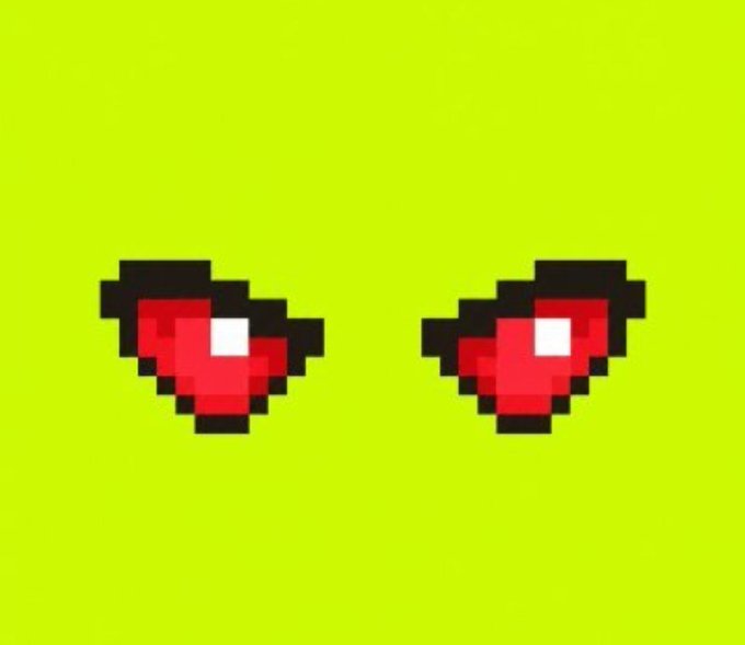 A pixel art illustration of two red, diamond-shaped gems with white highlights on a bright green background.