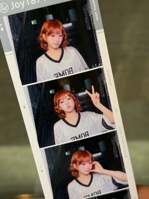 A photo strip showing three pictures of a young woman with reddish-brown hair wearing a white "BUMP" t-shirt, making various poses including a peace sign, with "JoyTo" and "KEEP YOURS" visible on the strip.