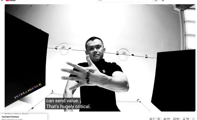 A black-and-white YouTube video screenshot showing a tattooed man gesturing toward the camera, with the caption 'can send value. That's hugely critical.'