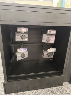 The image shows a black storage cabinet containing four labeled drawstring bags, each marked "ETSS" on white tags. It illustrates a community contribution post highlighting organized team equipment storage.