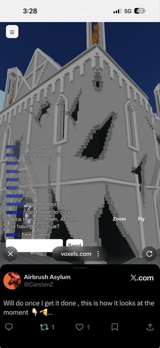 A screenshot of a Voxels virtual world stream showing a damaged gray building, with an embedded X.com post from 'Airbrush Asylum (@CarstenZ)' reading 'Will do once I get done, this is how it looks at the moment' with pointing and peace emojis.