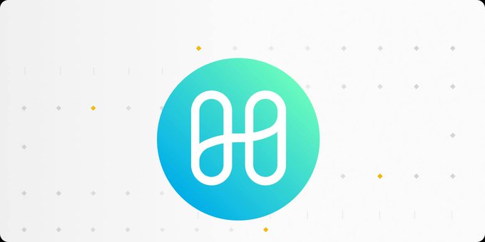 The image displays the Harmony (ONE) cryptocurrency logo—a stylized white "H" inside a teal-to-green gradient circle—set against a light background with small decorative star and diamond accents. This logo represents Harmony, the layer-1 blockchain project mentioned in the post that is shutting down its blockchain operations to pivot toward an AI video platform.