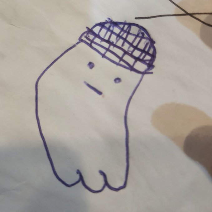A child's purple marker drawing of a simple, ghost-like figure with two dot eyes and a small mouth, wearing a crosshatched cap, displayed on a piece of paper—shared as a charming, family-made version of the poster's profile picture to greet followers on Friday.
