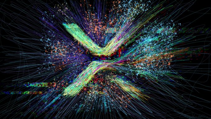 The image features a large, colorful abstract design with lines of different colors and shapes scattered across a black background. The letters "X" are prominently displayed within this vibrant display. The caption below the image reads, "Apparently we have some work to do in letting X know that we want our cashtag to be visible. Use the $ATM cashtag in your posts! Comment and tag @ATM_xrpl". This message is related to a post about ATM cards on social media platforms.