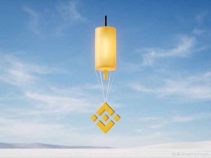 A yellow cylindrical package suspended by strings carries the Binance "B" logo as it descends against a sky backdrop, visually tying to the post's "Special delivery" message for @MO_BSCHAIN. The watermark "© Binance Angels" is visible in the corner.