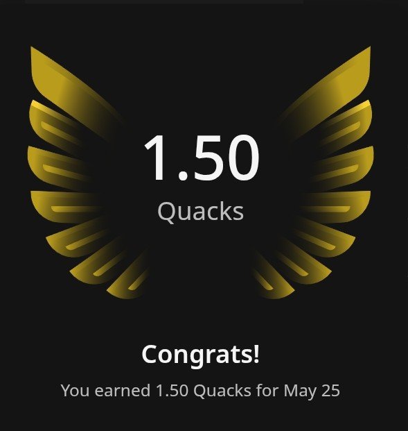 The image shows a black background with a gold bird's wing design at the top center of the frame. Below the wing, there is text that reads "congrats you earned 1.5 quacks for May 25". The main focus of the image is on the gold bird's wing and its accompanying text.