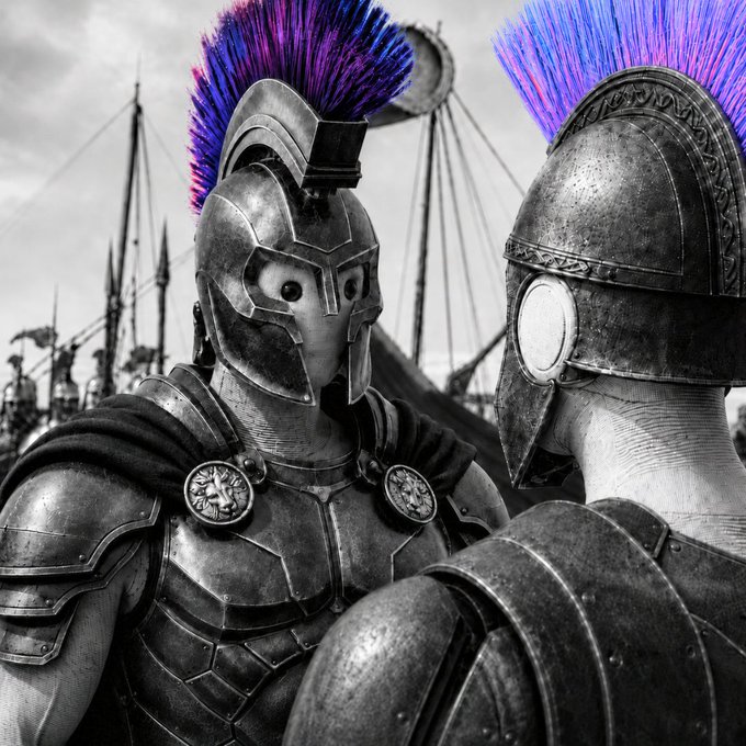 Two armored warriors with vibrant purple and blue plumed helmets face each other in a black-and-white scene, embodying the strategic assembly of a powerful "army" of specialized tools rather than brute-force combat. The vivid, color-saturated crests against the monochrome backdrop symbolize how standout, well-chosen agents stand out within a larger coordinated force.