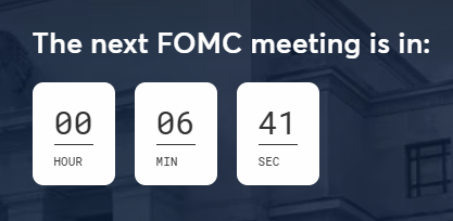 Countdown timer graphic with text 'The next FOMC meeting is in:' showing 00 HOUR, 06 MIN, 41 SEC against a dark building background.