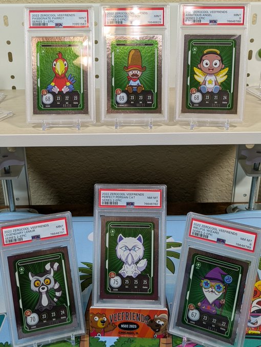 A display of six graded 2022 'Veefriends' trading cards from PSA and MCC, featuring various characters like Parrot, Emperor, Aimé, Lemur, Perfect Persian Cat, and Wizard, each showing distinct stats and collection numbers.