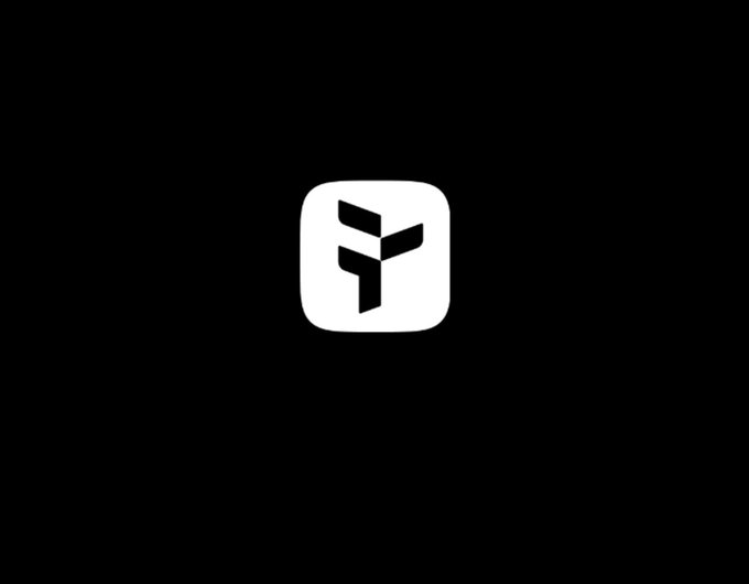 A simple white app icon featuring a stylized "Q" logo on a black background, representing the QuipNetwork brand mentioned in the post.