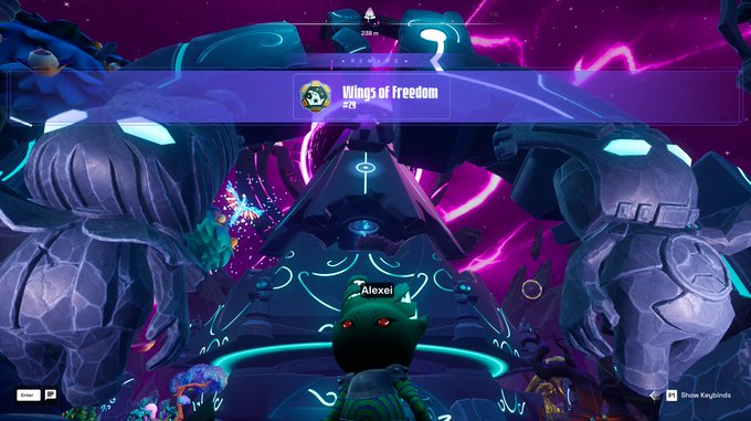 A video game screenshot shows a character named 'Alexel' in a 'Wings of freedom' area with large statues and purple energy effects.