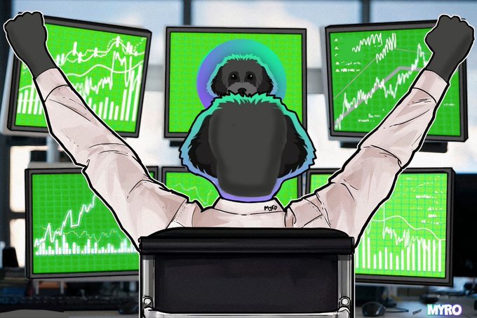 The main focus of the image is a man wearing a hat with his hands up, seated at a computer desk inside an office setting surrounded by multiple monitors displaying graphs and charts related to finance or stock markets. The content displayed on one of the screens reads "migrating soon". This suggests that the man may be planning to migrate or has recently done so for financial reasons such as investing in stocks, buying properties, or seeking job opportunities in another city, state, or country.