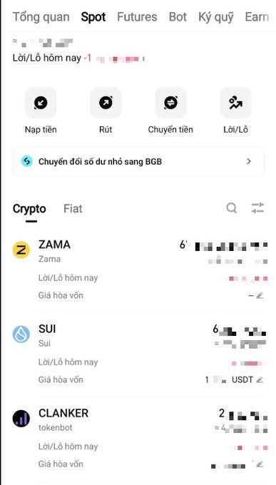 The image shows a phone screen displaying various cryptocurrency options, including ZAMA, ZAMB, and SUSIAH. The screen also has a search bar that allows users to find specific information about these cryptocurrencies. The text on the screen is in Vietnamese, which suggests that this might be an app or website for a Vietnamese-speaking audience.