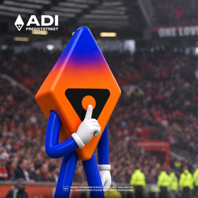 An orange and blue ADI PredictStreet mascot gestures with a finger to its lips in a "shushing" motion against the backdrop of a crowded stadium, embodying the post's message of letting your predictions speak for themselves. The image features the "ADI PREDICTSTREET" logo in the top-left corner and a disclaimer at the bottom stating "PREDICTION MARKETS INVOLVE RISK. NOT AVAILABLE IN ALL JURISDICTIONS. PLEASE PARTICIPATE RESPONSIBLY."
