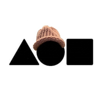Three geometric shapes—a black triangle, a black circle wearing a knitted beige hat, and a black square—are displayed against a white background.