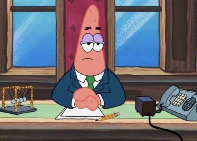 Patrick Star sits hunched over a desk in a suit and tie with a bored, resigned expression, next to a phone and Newton's cradle, capturing the weary patience of someone holding a tiny Bitcoin stake and hoping for it to multiply threefold during a bull run.