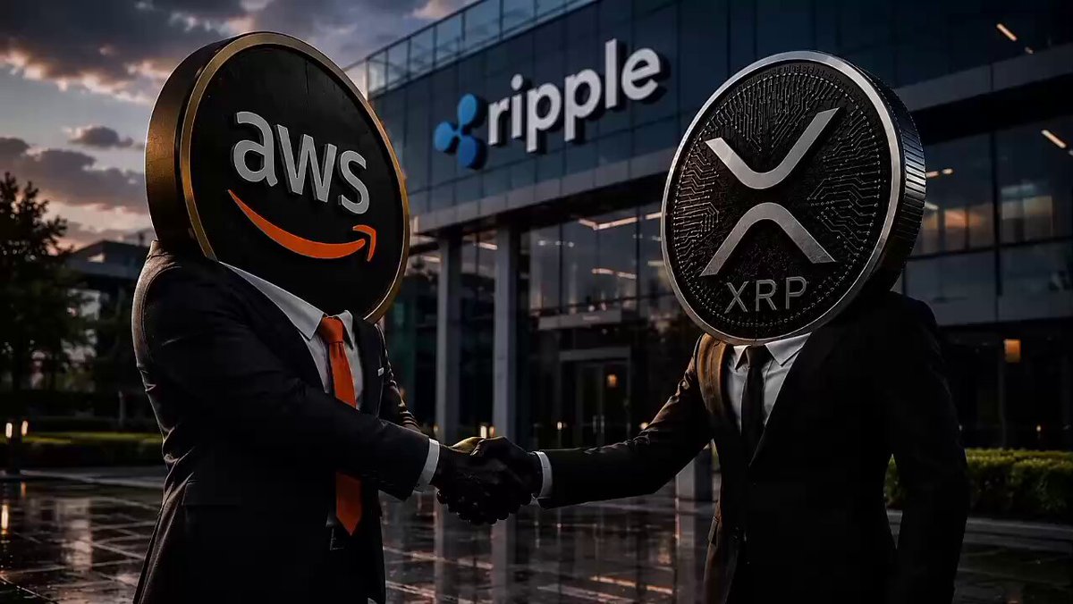 The image features two men wearing suits with "Ripple" written on their heads, standing outside a building that has an "AWS" sign above its door. The man on the left side of the image is shaking hands with the other man who is also wearing a suit and a "XRP" logo on his head. This unusual scene suggests that they are either participating in or promoting Ripple's blockchain solutions, which could be related to the AWS partnership.